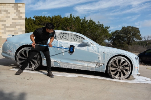 Car detailing professional at work